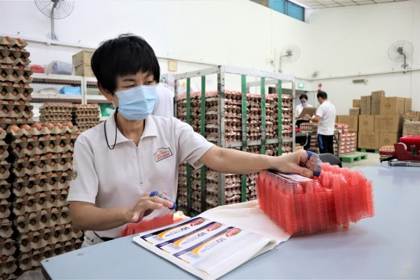 Madam Ng doing some labelling work