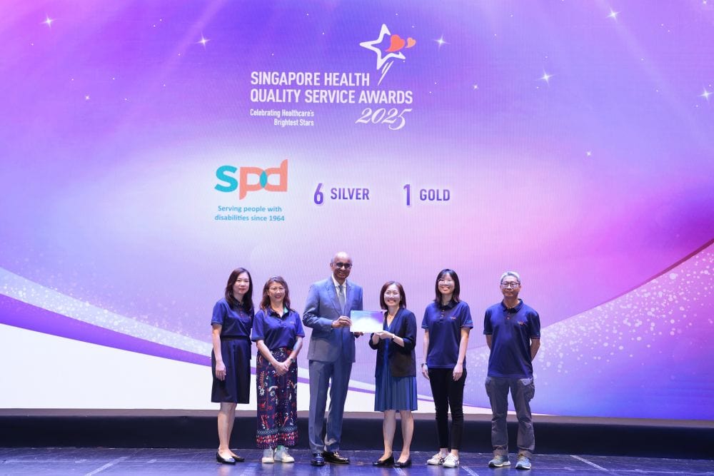 Going Above and Beyond: Celebrating SPD’s Service Excellence Award Winners 1 S P D's recipients of the S H Q S on stage with President of Singapore Mr Tharman.