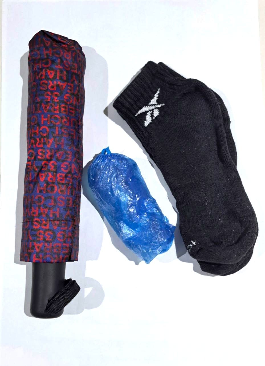 Social Work Day 2025 – What's inside a social worker’s bag 6 A foldable umbrella, shoe covers and a pair of black ankle socks.