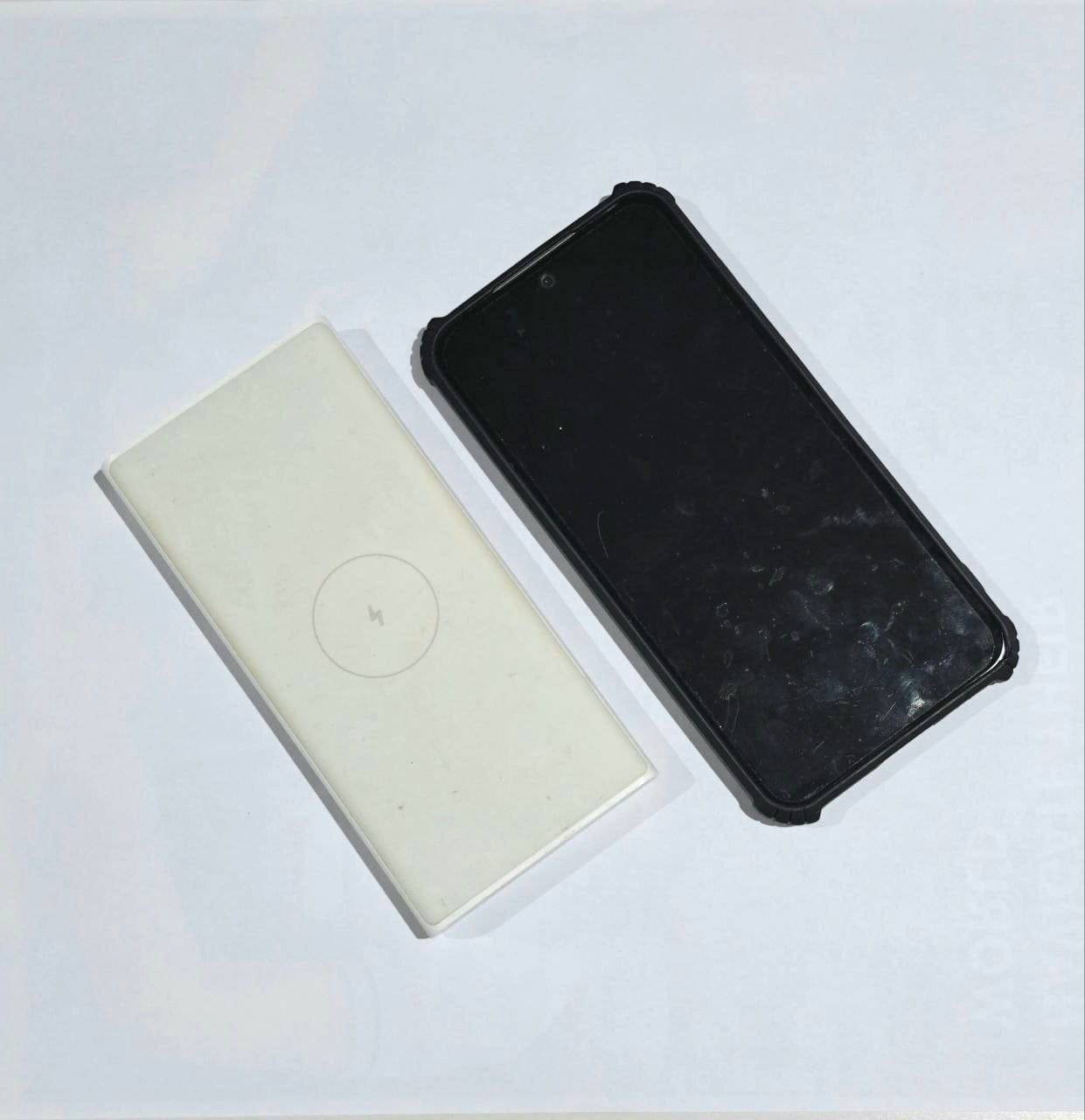 Social Work Day 2025 – What's inside a social worker’s bag 4 A white power bank and a smartphone.
