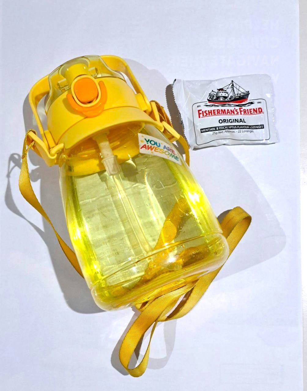 Social Work Day 2025 – What's inside a social worker’s bag 2 A yellow water bottle and a pack of Fisherman Friends white packet mints.