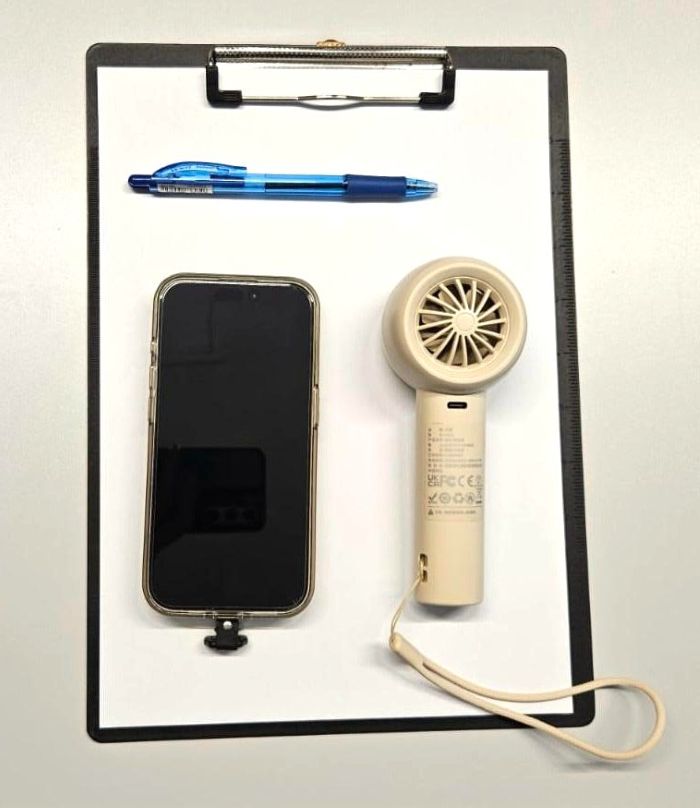 What’s inside their bags? - Employment support professionals' edition 3 Rebecca's handphone, pen, clipboard and portable fan