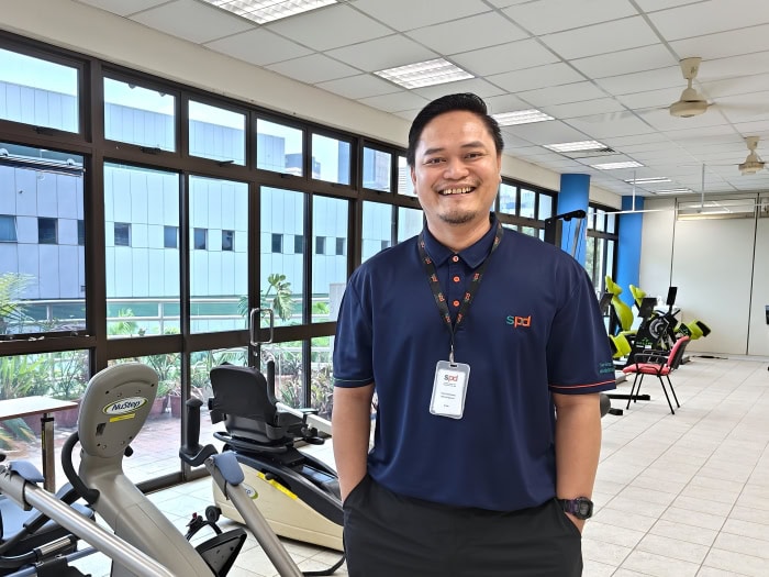 A Day in the Life of a Community Physiotherapist 2 Audi in the rehabilitation centre, standing beside some exercise machines