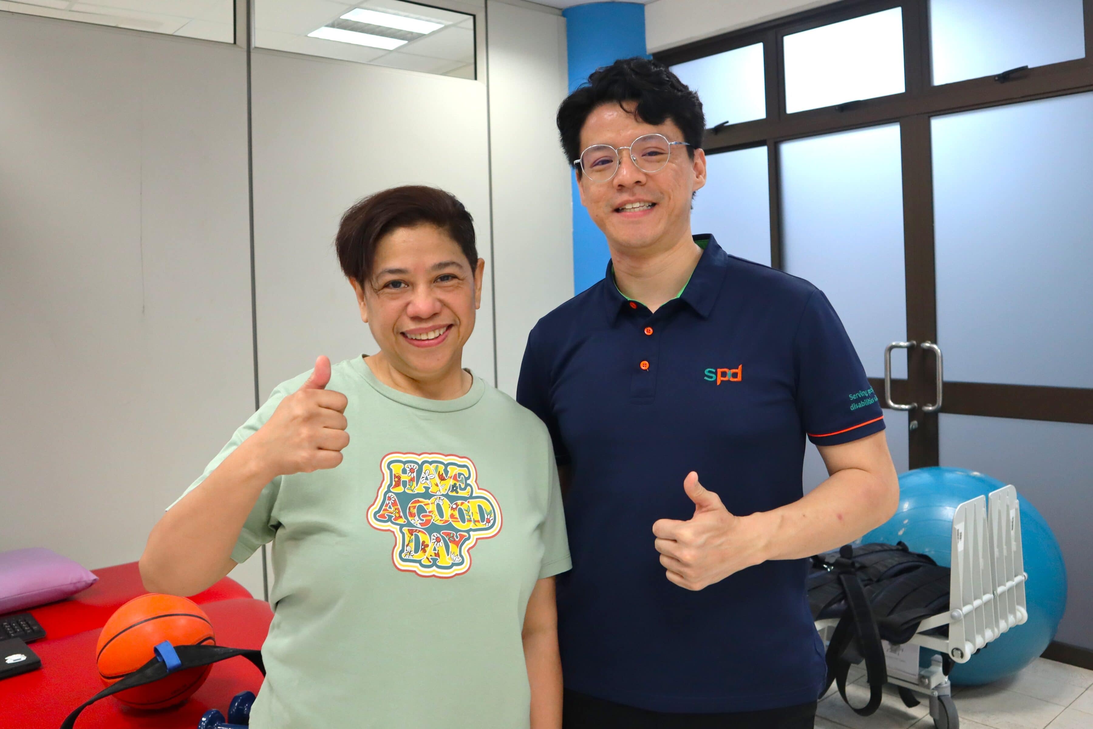 Power of Care – Celebrating Every Step Forward 3 Chris and a client giving thumbs up