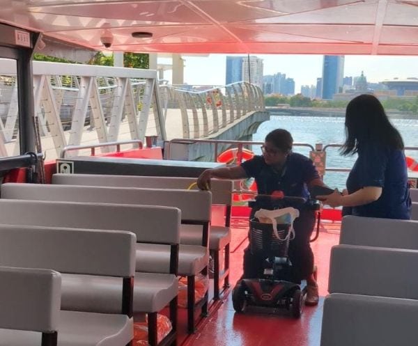 Behind the scenes: Bringing an inclusive cruise ride to life at SPD Ability Walk 2025 4 S P D professional seated in a mobility scooter on board the cruise checking on the accessibility.