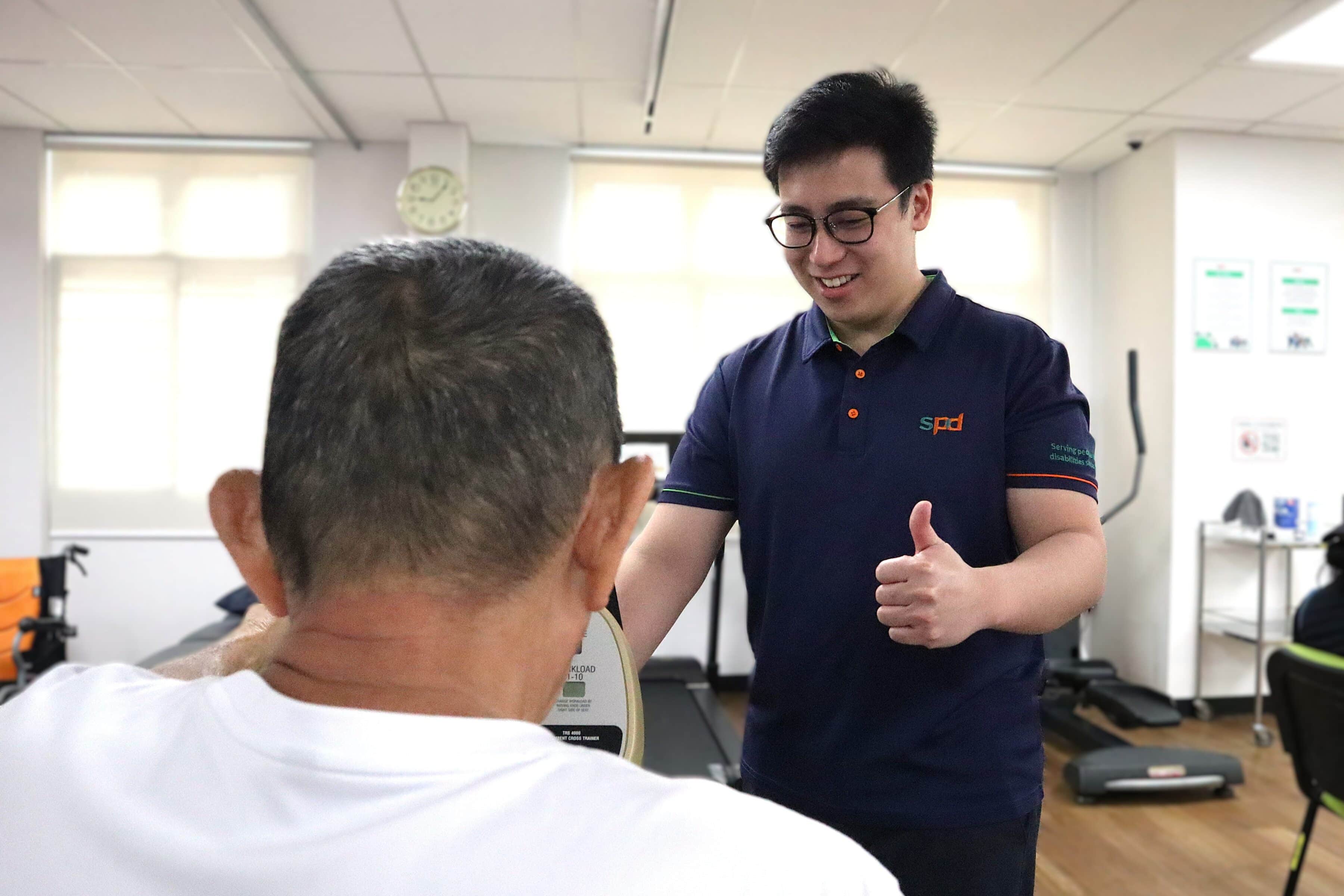 Power of Care – Growing with Purpose 4 Joel encouraging a senior on a rehab equipment.