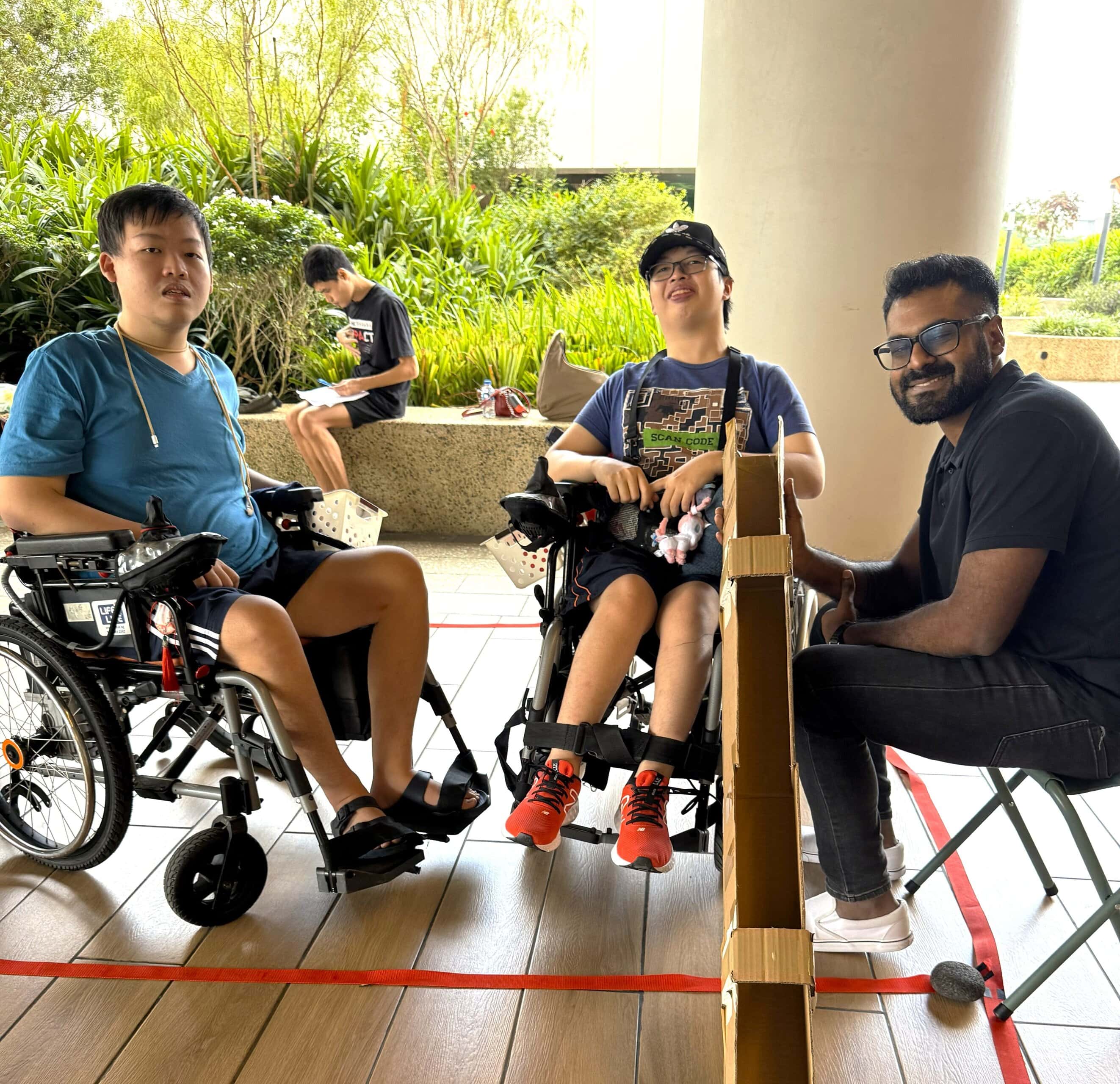 Strength in Community: Living with vision and hearing loss, youth volunteer supports others through boccia 1 Vinid with 2 E S H Punggol wheelchair users playing boccia