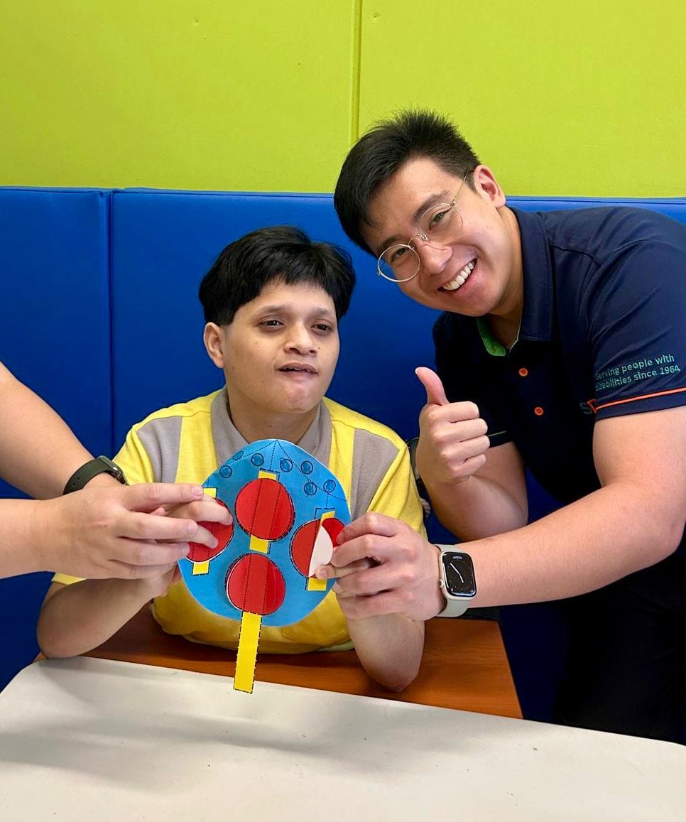 Power of Care – Growing with Purpose 2 Joel and a D A C client posing with her craftwork