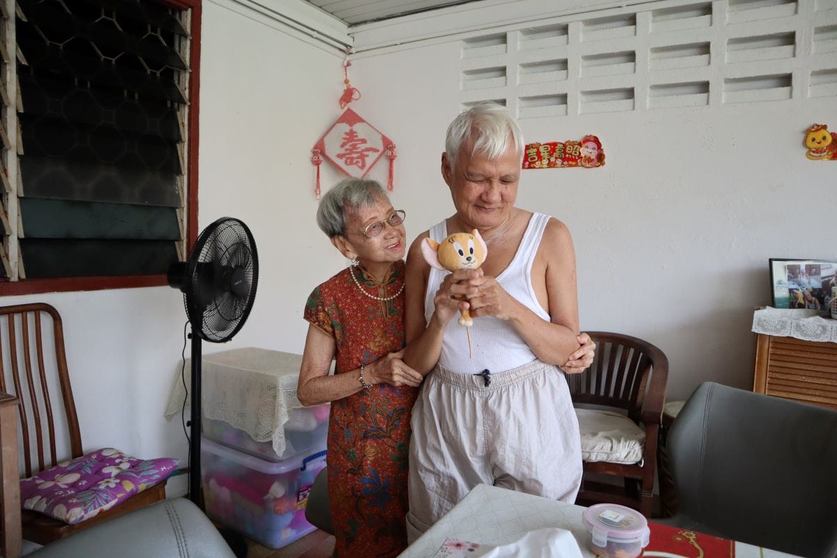 A Heart That Never Grows Old: Auntie Molly’s volunteer journey with SPD 2 Auntie with her arm around her youngest son Mr Lee, who is holding up a small soft toy.