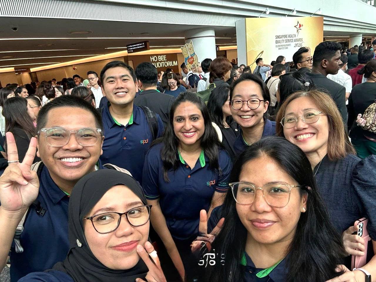 Celebrating Service Excellence at SPD: Honouring our Singapore Health Quality Service Awards 2026 recipients 6 Selfie of winners and S P D assistant C E O Ms Tay Soong Kiang, and volunteer management senior executive George Tai