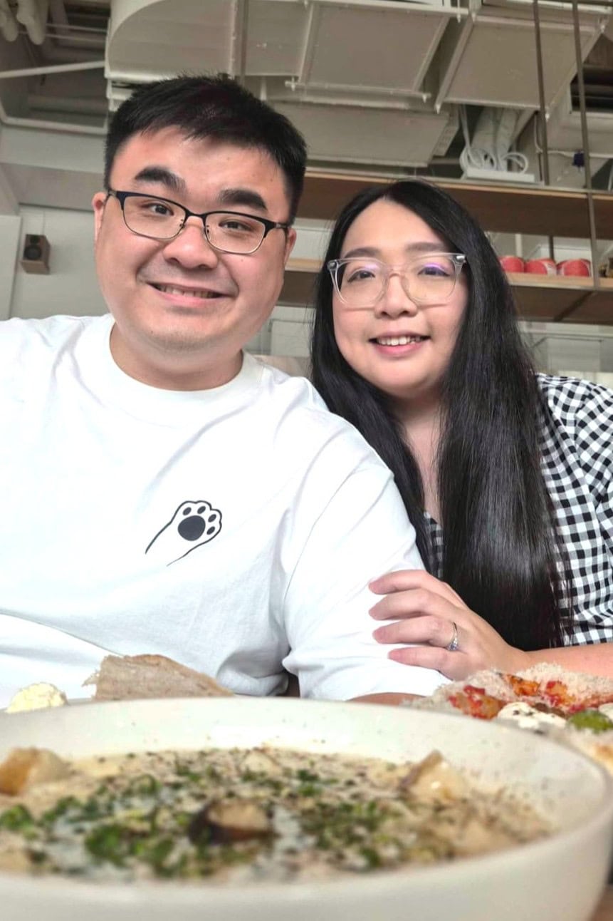 Kishon and Kelly smiling, in the foreground is a bowl of mushroom soup