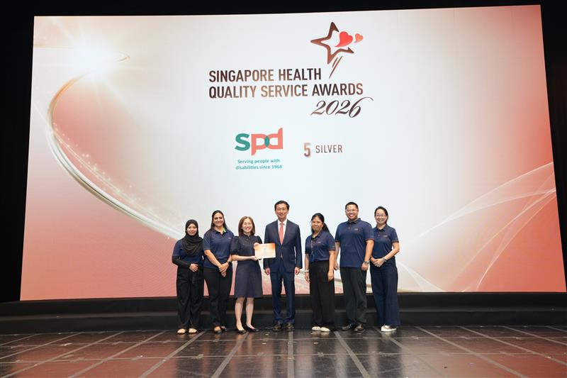 Celebrating Service Excellence at SPD: Honouring our Singapore Health Quality Service Awards 2026 recipients 1 S P D's S H Q S A winners on stage with guest of honour Mr Ong Ye Kung