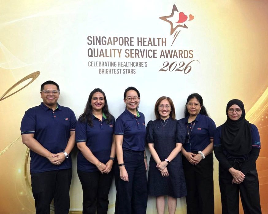 Celebrating Service Excellence at SPD: Honouring our Singapore Health Quality Service Awards 2026 recipients 5 Winners and S P D assistant C E O Ms Tay Soong Kiang against the S H Q S A backdrop