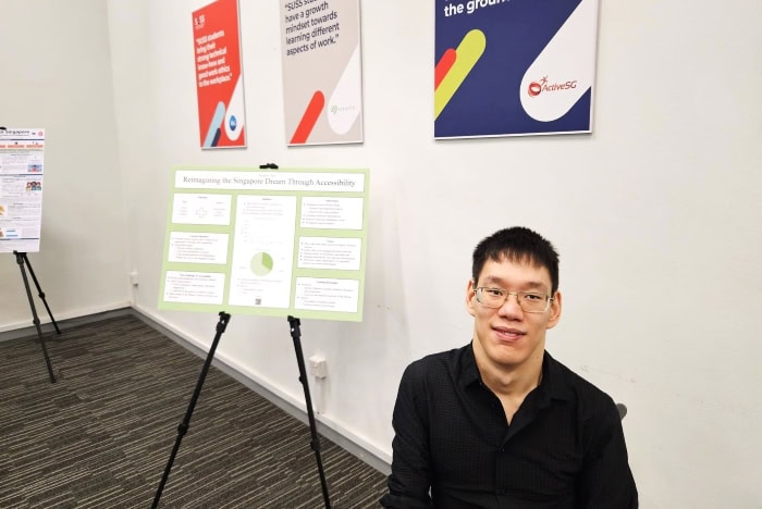 Zachary at S U S S with his poster presentation on reimagining the Singapore Dream through accessibility.