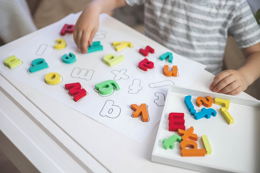 Colourful alphabet magnets on a table