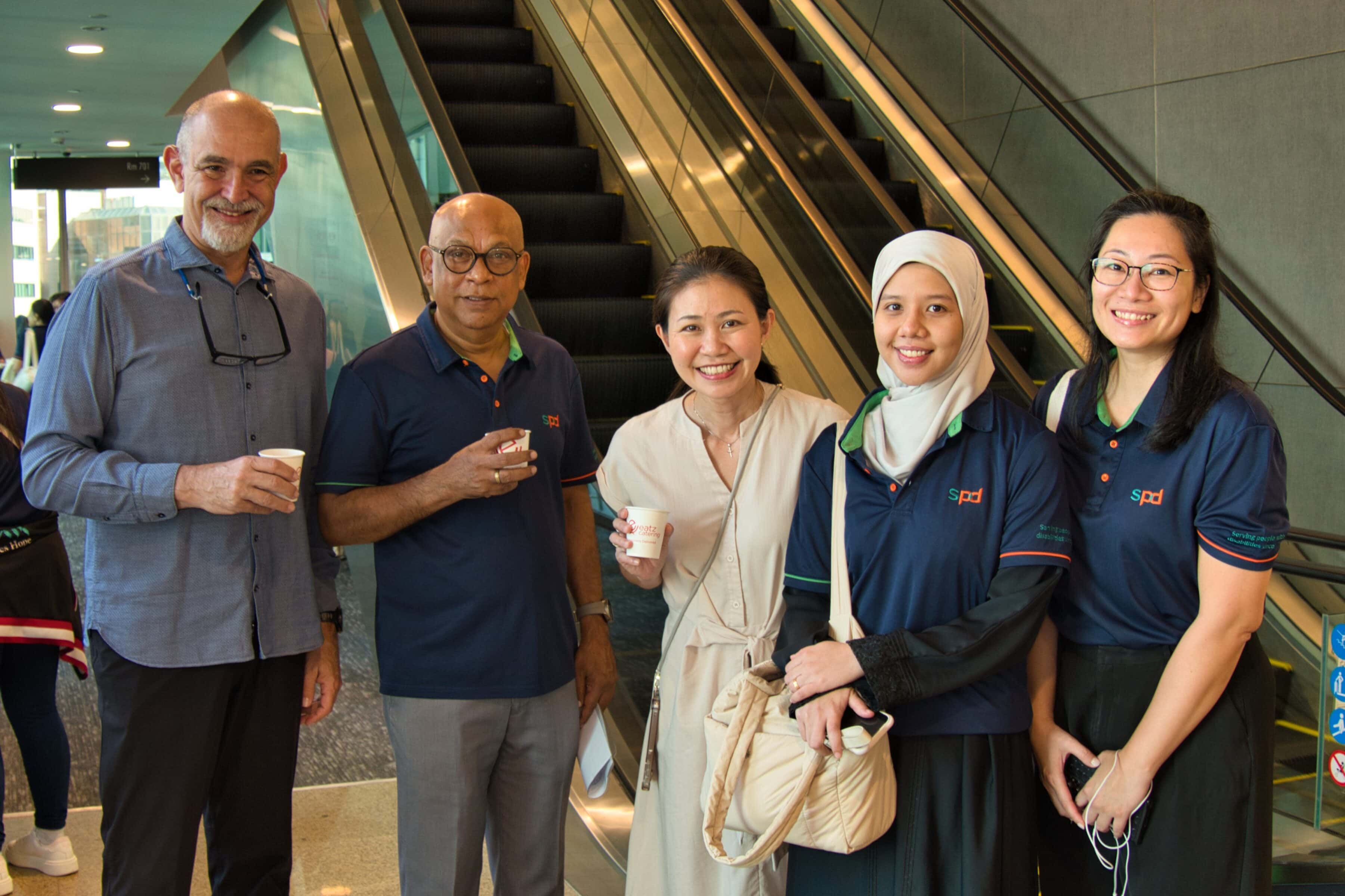 A Working Mum’s Perspective on Excellence - Lessons from Dr May Lim 1 Dr May Lim with Dr Fermin Diez, Mr Pal and 2 occupational therapists