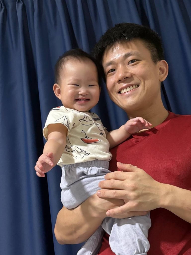 Showing Up with Heart: Occupational therapist Bradley Lam on fatherhood and caregiving 4 Bradley holding his daughter in his arms