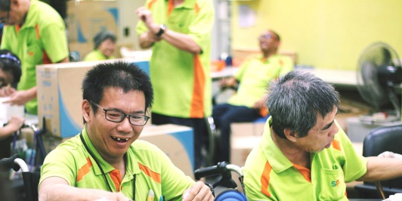SPD Sheltered Workshop trainees assembling race packs