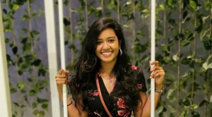 Volunteer Santhia sitting on a swing