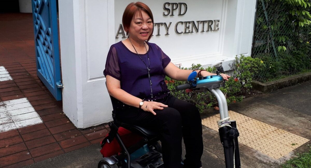 Jane on her mobility scooter outside SPD Ability Centre
