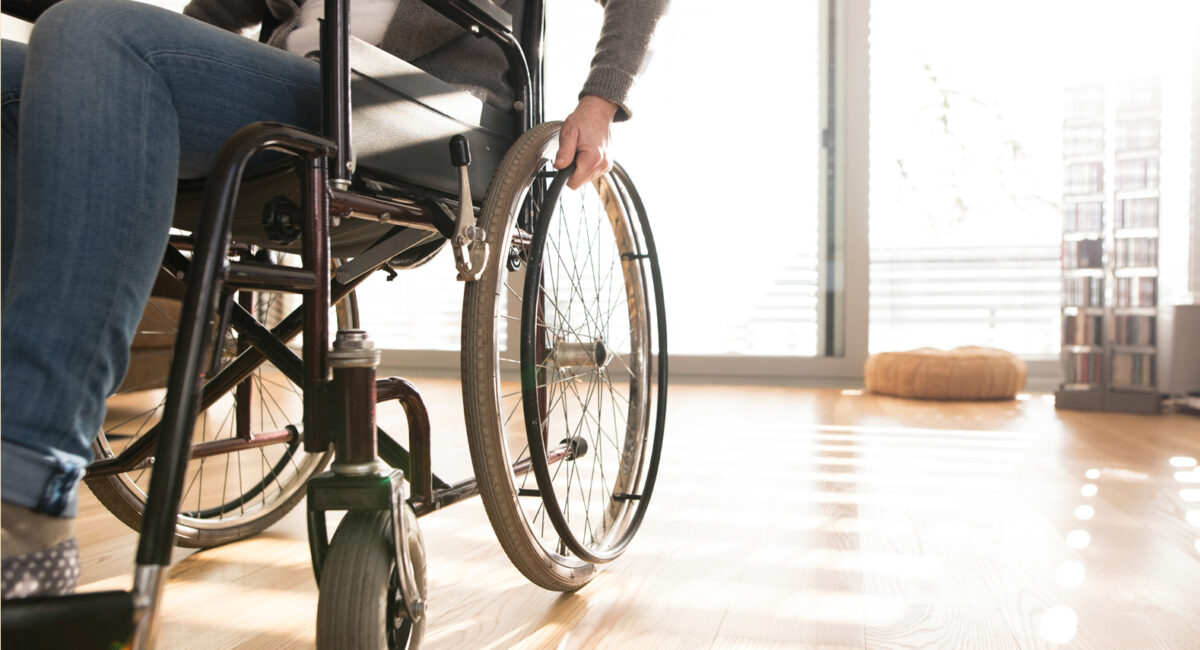 Person using a wheelchair in a room