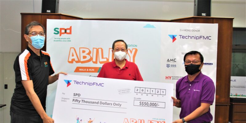 Guest-Of-Honour Dr Tan See Leng at the cheque presentation with SPD President Mr Winston Ngan and TechnipFMC Vice President Manufacturing Operations Mr Roger Tan