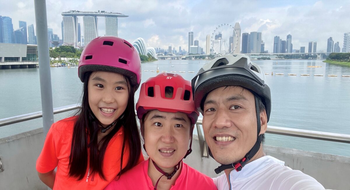 A family of three smiling
