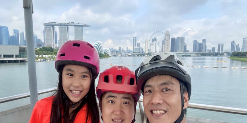 A family of three smiling