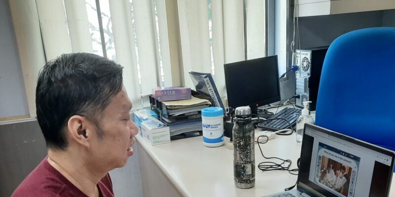 Man looking at laptop screen