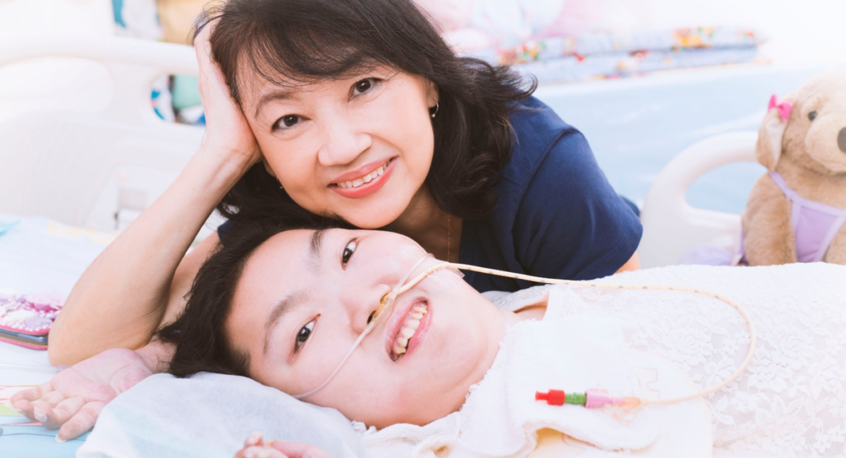 Two women posing and smiling for the camera