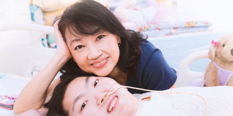 Two women posing and smiling for the camera
