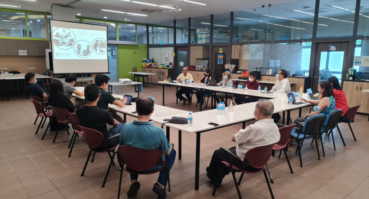 A group of people in a meeting