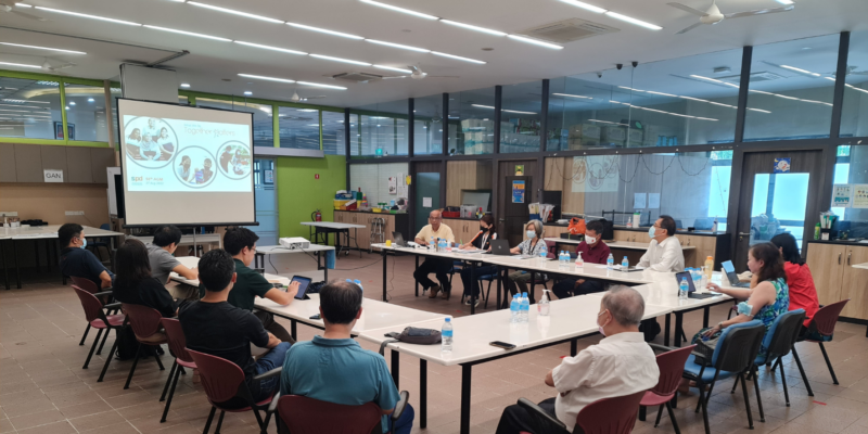 A group of people in a meeting