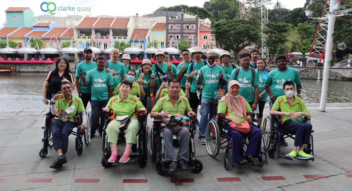 A photo of S P D volunteers, staff and trainees at an outdoor event