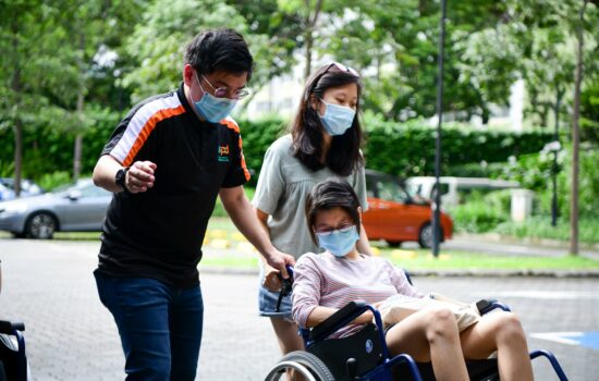 S P D staff conducting wheelchair handling practice with members of the public