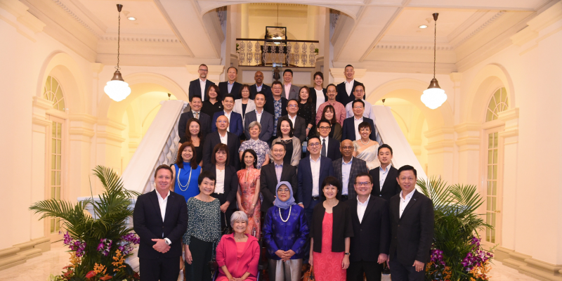 A group photo of S P D donors and President Halimah Yacob at the Istana