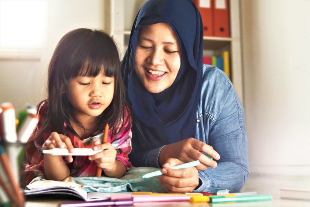 A mother helping her daughter in homework