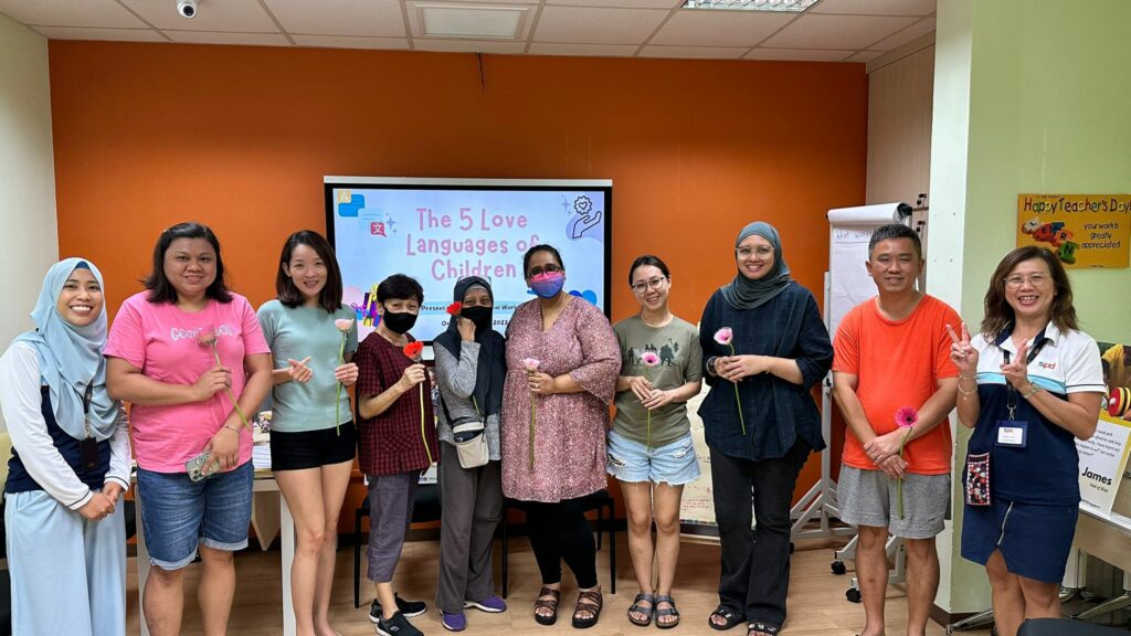 Two S P D social workers together with eight participants from one of the workshop sessions
