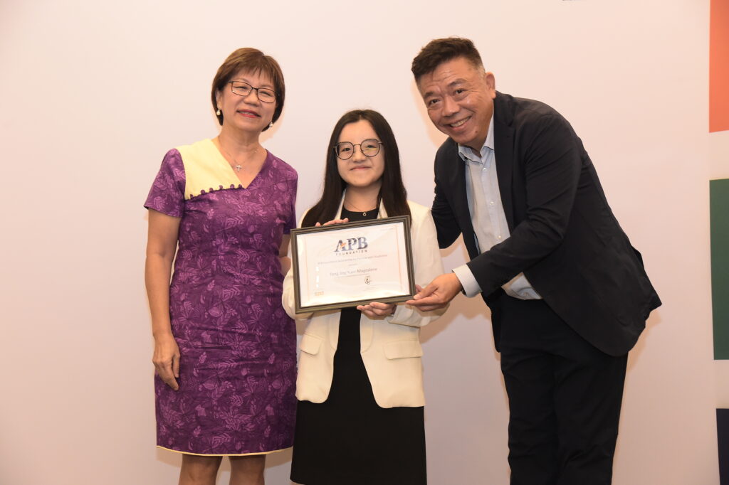 From left - GOH Ms Denise Phua, scholarship recipient Magdelene Tong, Chairman, Board of Trustees, APB Foundation Mr Kenneth Choo