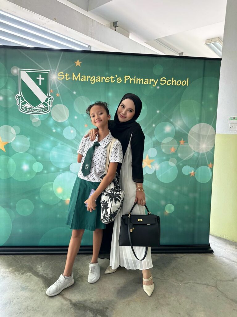 Moza in her St Margaret's Primary school unform with her mum