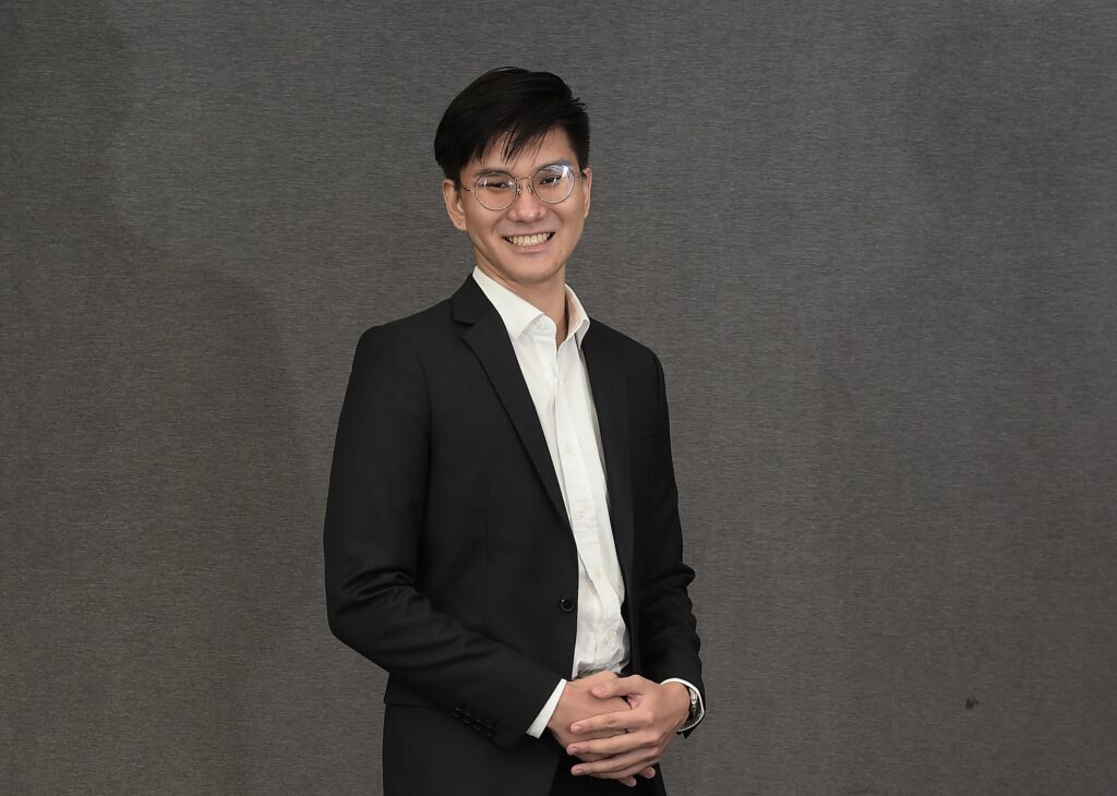 Bjorn in black jacket and white shirt, smiling