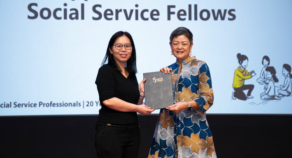 S P D principal occupational therapist Tay Hwee Lin receiving the National Council of Social Service’s Social Service Fellowship from NCSS President Ms Anita Fam