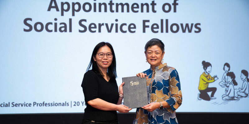 S P D principal occupational therapist Tay Hwee Lin receiving the National Council of Social Service’s Social Service Fellowship from NCSS President Ms Anita Fam