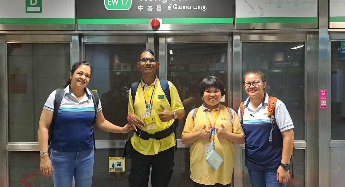 D W W clients and S P D D A C training officers at Tiong Bahru train station