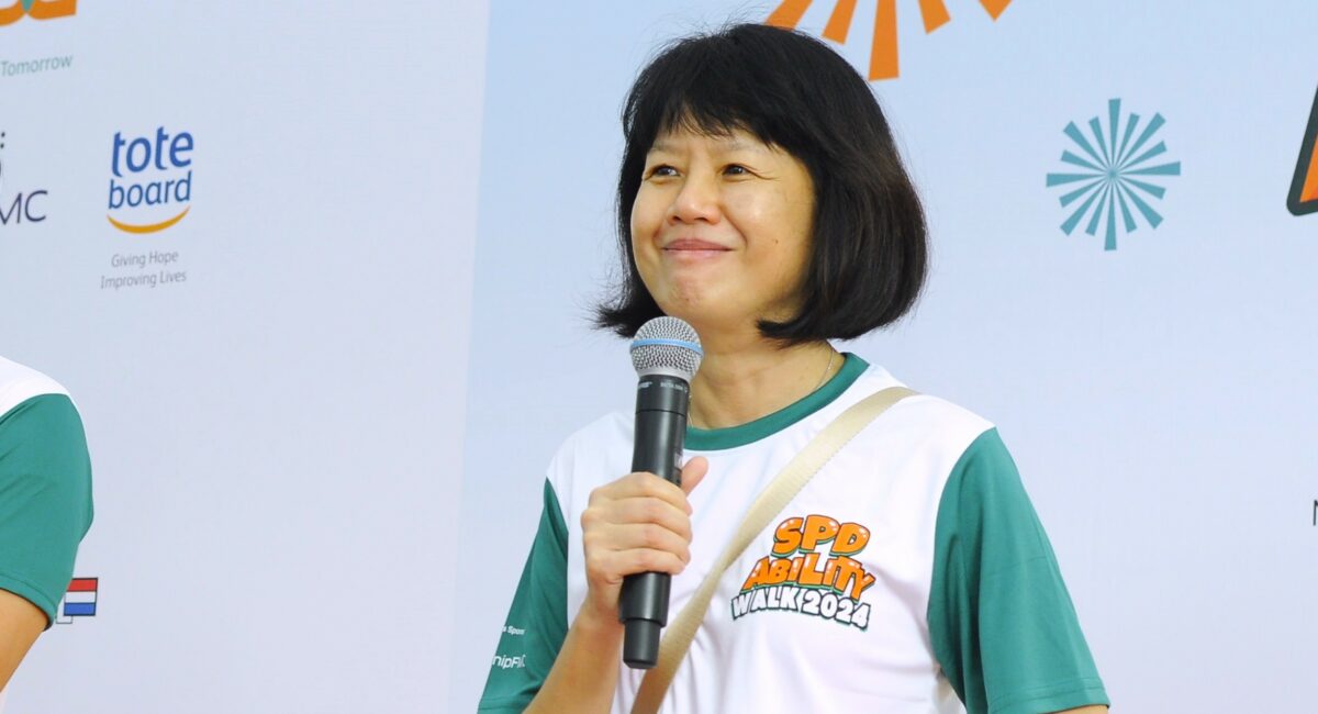 President of SPD Ms Ong Toon Hui giving a speech on stage at the SPD Ability Walk 2024