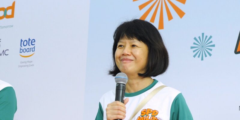 President of SPD Ms Ong Toon Hui giving a speech on stage at the SPD Ability Walk 2024