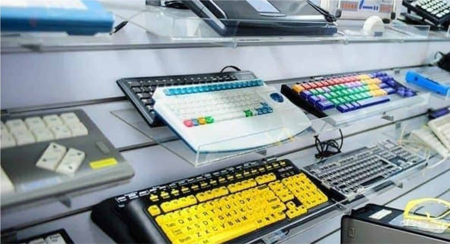 Different types of keyboards, including one with high contrast black letters on yellow keys.