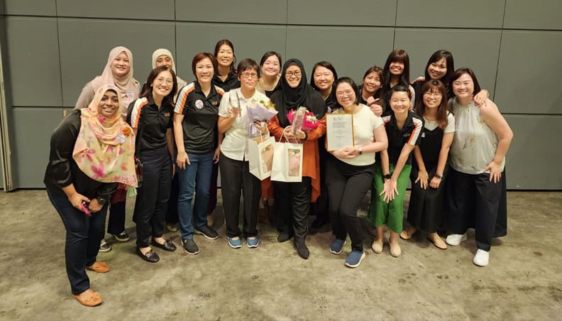 Wai Ching and Jannah (centre) with their colleagues after receiving their awards at the ECDA Awards 2023 presentation ceremony