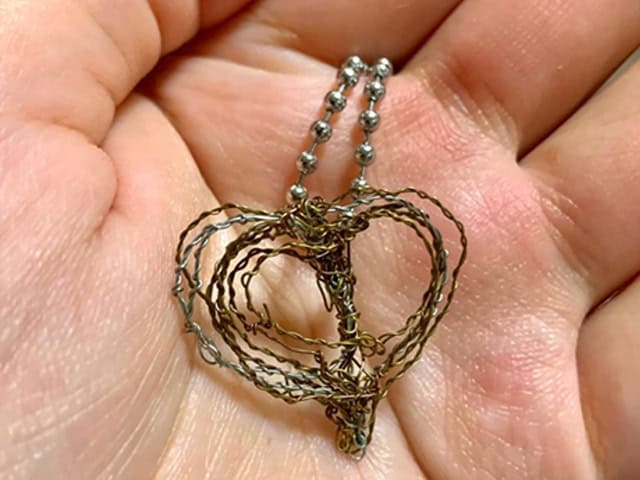 Pendant made of wire which Joshua created for his girlfriend