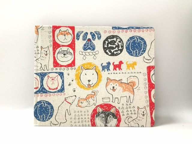 S P D Artisan Collab journal with fabric cover consisting different illustrated dogs